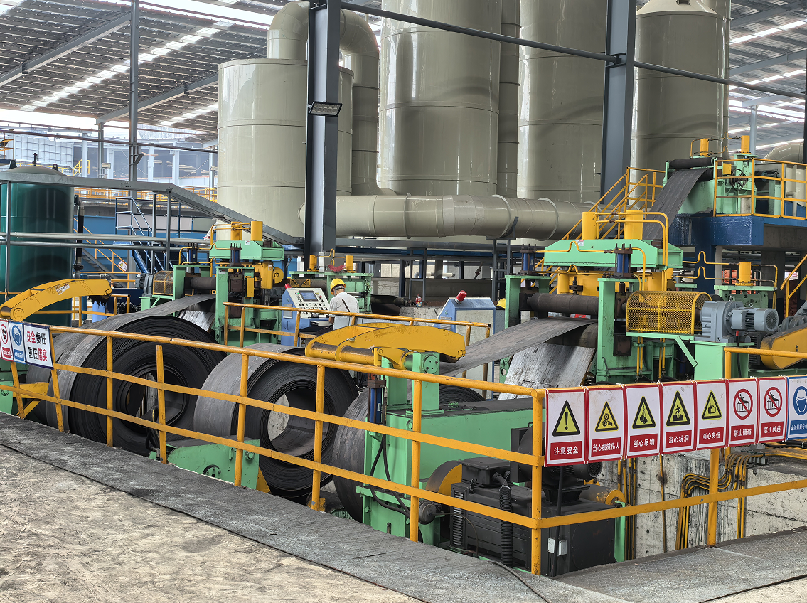 A pickling line removes scale and rust from metal surfaces for further processing. Steps include uncoiling, pickling, rinsing, drying, and recoiling.